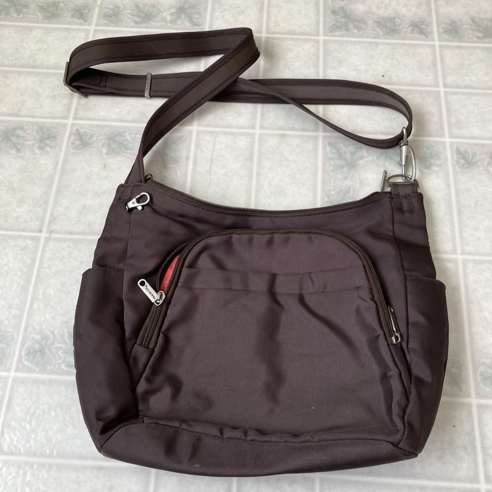 Travelon crossbody satchel with RFID security brown with cheerful Coral Lining